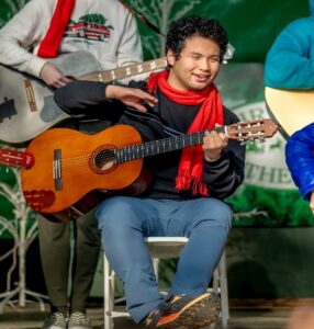 Alan performing at Christmas in the park with CAA students